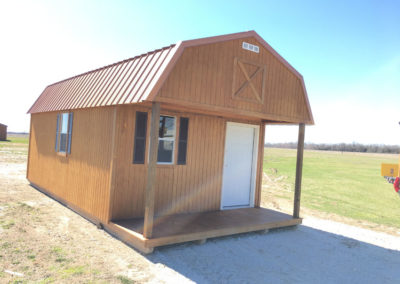 12x24 Lofted Cabin with a Copper Metallic metal roof and optional black shutters.