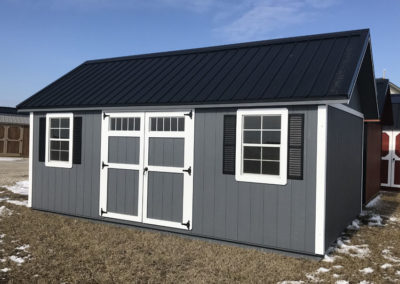 A 10x20 Painted Lofted Garden Shed with Charcoal walls, white trim, and Black metal roof and optional shutters. Also shown with optional windows in the double doors and optional 1 ft. overhang on the roof end walls.